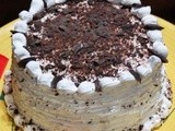 Dark chocolate cake with whipped cream