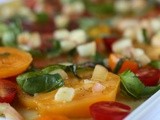 Heirloom and cherry tomatoes with peach-basil vinaigrette
