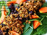 Blueberry and basil, papaya, spinach salad with a chilli and agave pistachio nut topping