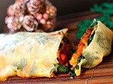 Hot and spicy mushroom and cauliflower baked giant spring roll with a cheesy spinach layer for a vegetarian Christmas