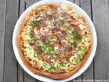 Flammkuchen with pancetta, red onions and chives
