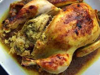 Moroccan Chicken m'qualli and stuffed with sweet couscous, a combination out of this world