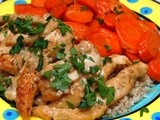 Chicken strips in a cognac cream sauce with glazed carrots over brown rice