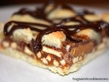 Sugar Cookie Bars Stuffed with Peanut Butter Cups, Pretzels & Caramel