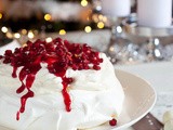 Pavlova with pomegranate and cranberry sauce