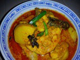 Nasi kunyit with nyonya kari kay [nyonya chicken curry]