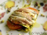 Tortino di sardoni con zucchine pomodori provola e pistacchi