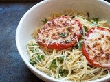 Spaghetti with cheesy broiled tomatoes and basil