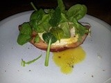 Ham steak with egg and spinach leaves