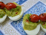 Deviled Eggs with Guacamole and grilled Cherry Tomatoes