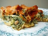 Raggedy pasta filled with spinach, ricotta, artichoke hearts topped with roasted red pepper pine nut sauce