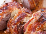 Bacon-Wrapped Stuffed Pork Tenderloin with Raspberry Chipotle Sauce