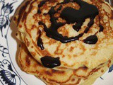 Old-fashioned oatmeal pancakes with butter-molasses sauce