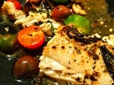 Pan fried and the roasted cod in a sauce of fresh vegetables and herbs