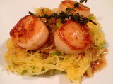 Seared scallops over spaghetti squash with crispy leeks