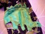 Mending knit pajama pants with a  dinosaur applique, (patches) for the little ones