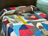 Today the Crazy Quilt Ida Bell and Ellen started a hundred years ago has been finished as a cozy comforter using a blanket stitched Alpaca yarn to complete the edges