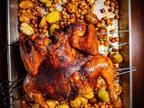 Butterflied chicken with baharat and roasted chickpeas and potatoes with lemon and oregano
