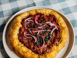 Lamb pizza with pickled onions