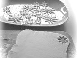 White fondant icing flowers, in black and white