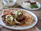 Spiced Moroccan Burgers with Green Harissa, Feta and Mint over Grilled Pita