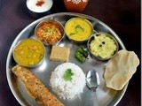 Gujarati Thali-Dal,Sev Tamatar Curry,Kadhi,Green Chilli Pickle