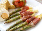 Asparagus wrapped with prosciutto and fresh salad