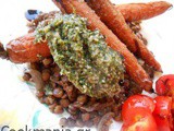 Roasted carrots with carrot top pesto and lentils