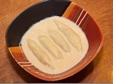 Dudh Puli: Steamed Dumplings in Milk Syrup
