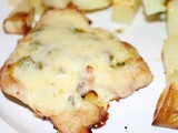Baked turkey steaks with pesto and cheese