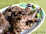 Coniglio nel coccio con olive e pinoli