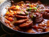 Spicy butter bean and tomato stew with turkish sujuk (garlic sausage)