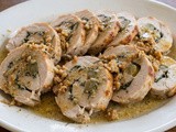 Turkey breast roll stuffed with herbs and grapes, cooked in milk