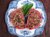 Beet & goat cheese roulade filled with greens and pinenuts