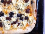 Pizza with olives, capers, caramelized onions and sweet potato mash