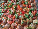 Baked Turkish mini meatballs, koftes in pepper and tomato sauce