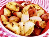 A side of roasted redskin potatoes with onions