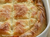 Cheese pie with Xinomyzithra and Bechamel Sauce