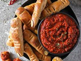 Cheesy Walking Dead Finger Breadsticks served with Roasted Red Pepper Red Wine Dip