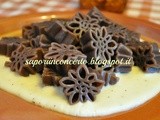 Stelle alpine al cioccolato su fonduta di formaggio