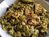 Orzo with broccoli pesto, spiralized courgette and black olives