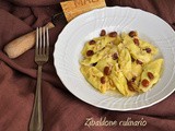 Tortelli con la coda al burro con pinoli e uvetta